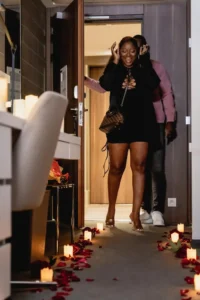 Two people with candles and flowers