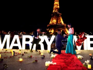 Couple holding violin with flowers candles