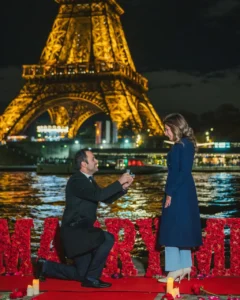 Man with camera Eiffel Tower dark