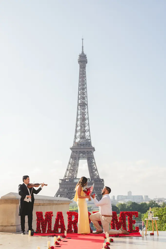 Couple on red carpet with violinist