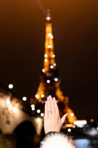 Persons hand with Eiffel Tower lights
