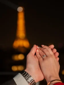 Persons hands with blurred Eiffel Tower
