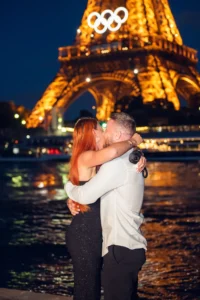 Couple kissing with Eiffel Tower lights
